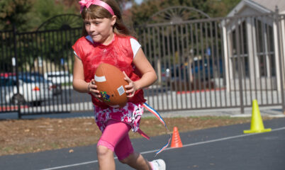 girl playing with football