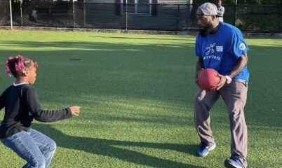 Coach Mase playing with a student