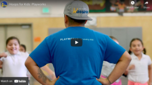 coach standing in front of children