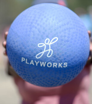 kickball with Playworks logo