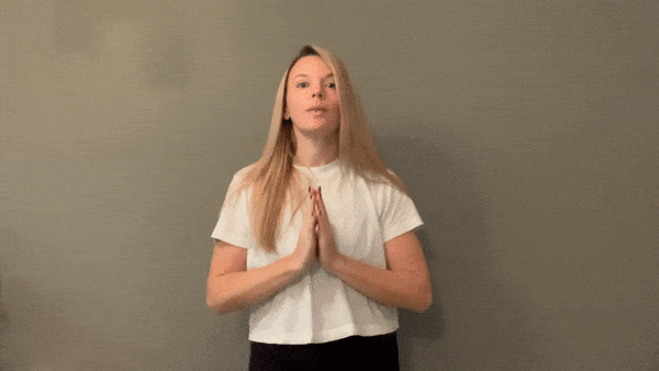 person miming volcano breath