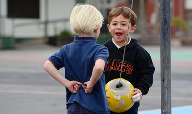 kids playing teatherball