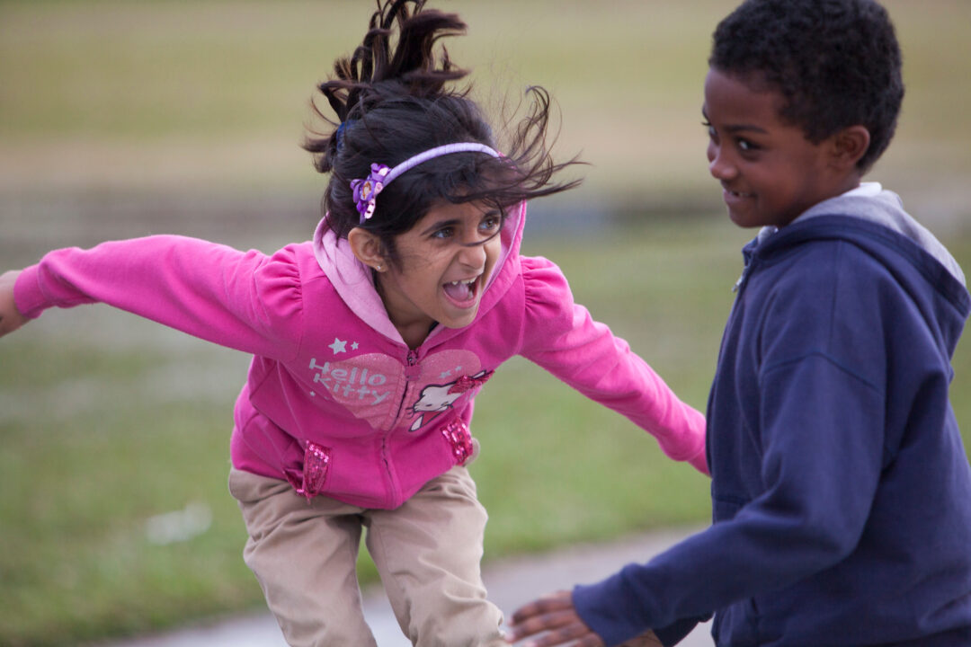 two kids jumping