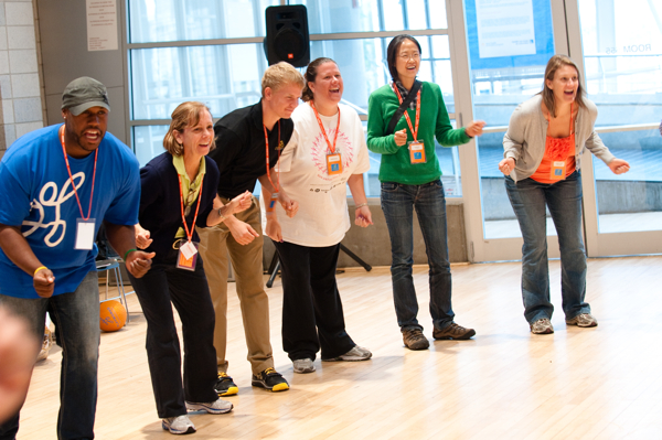 Playworks coaches participating in indoor games