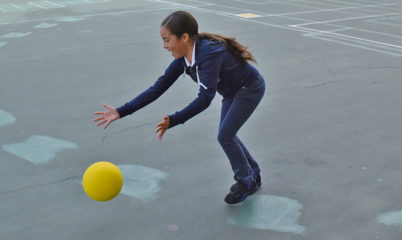girl playing with dodgeball