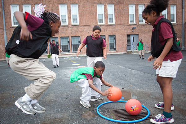 Children playing recess games like Sneak