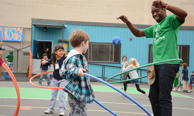 coach and students hula hooping