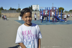 Kid in front of playground