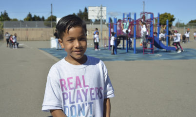 Kid in front of playground