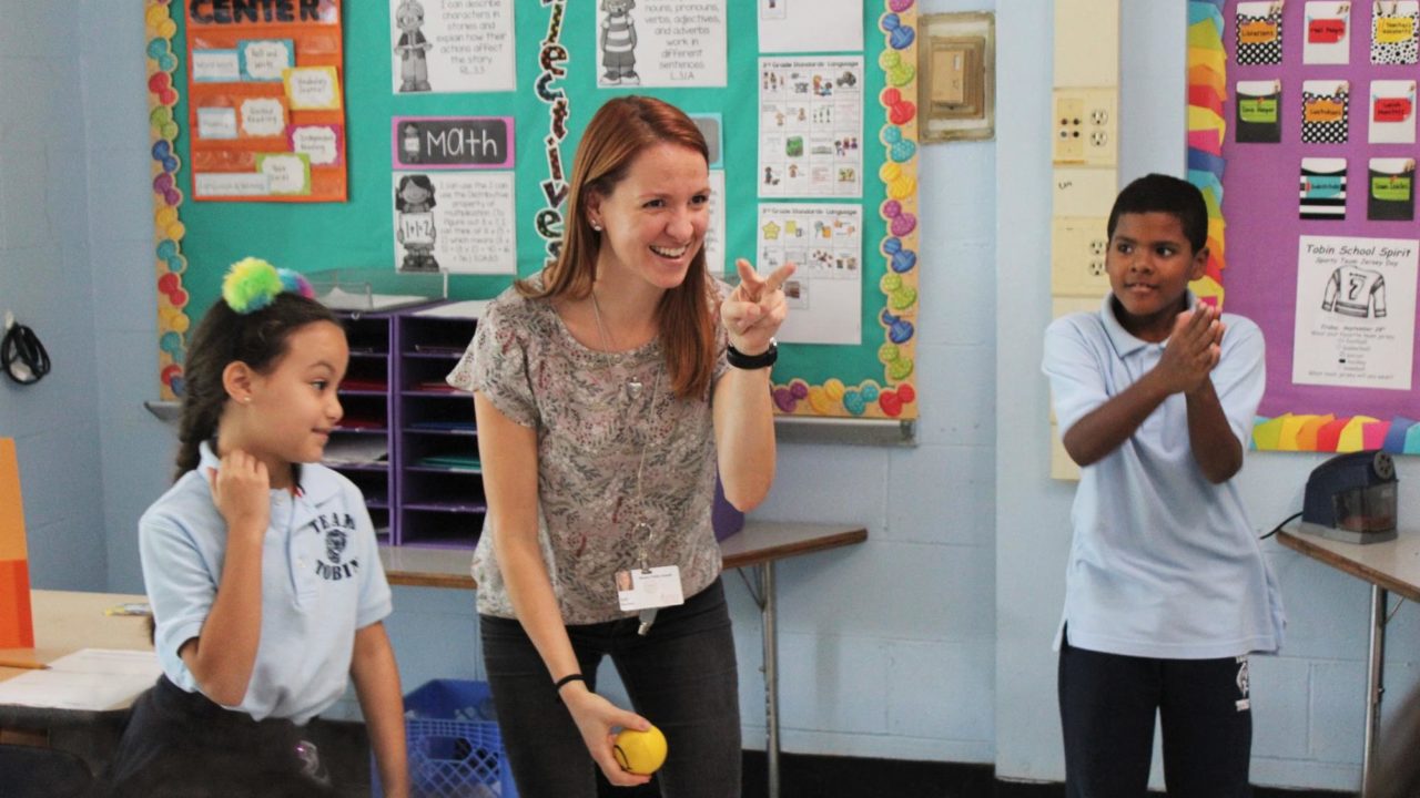 teacher playing with students