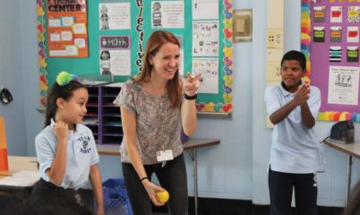 teacher playing with students