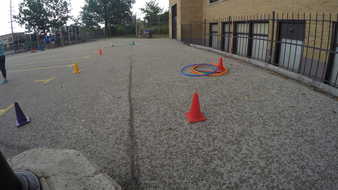 blacktop marked with cones for games