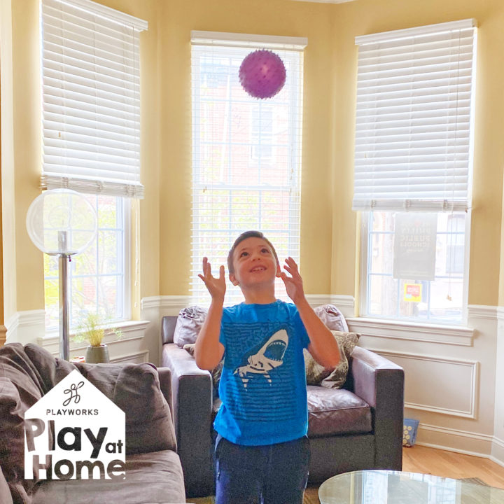 child playing with ball in home