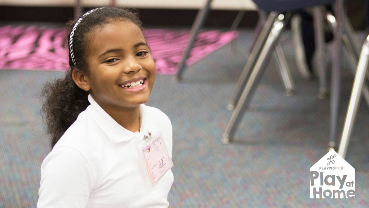 child smiling in classroom