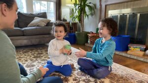 two children playing in living room