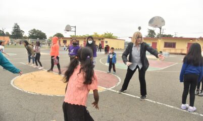 Elizabeth playing with kids at recess