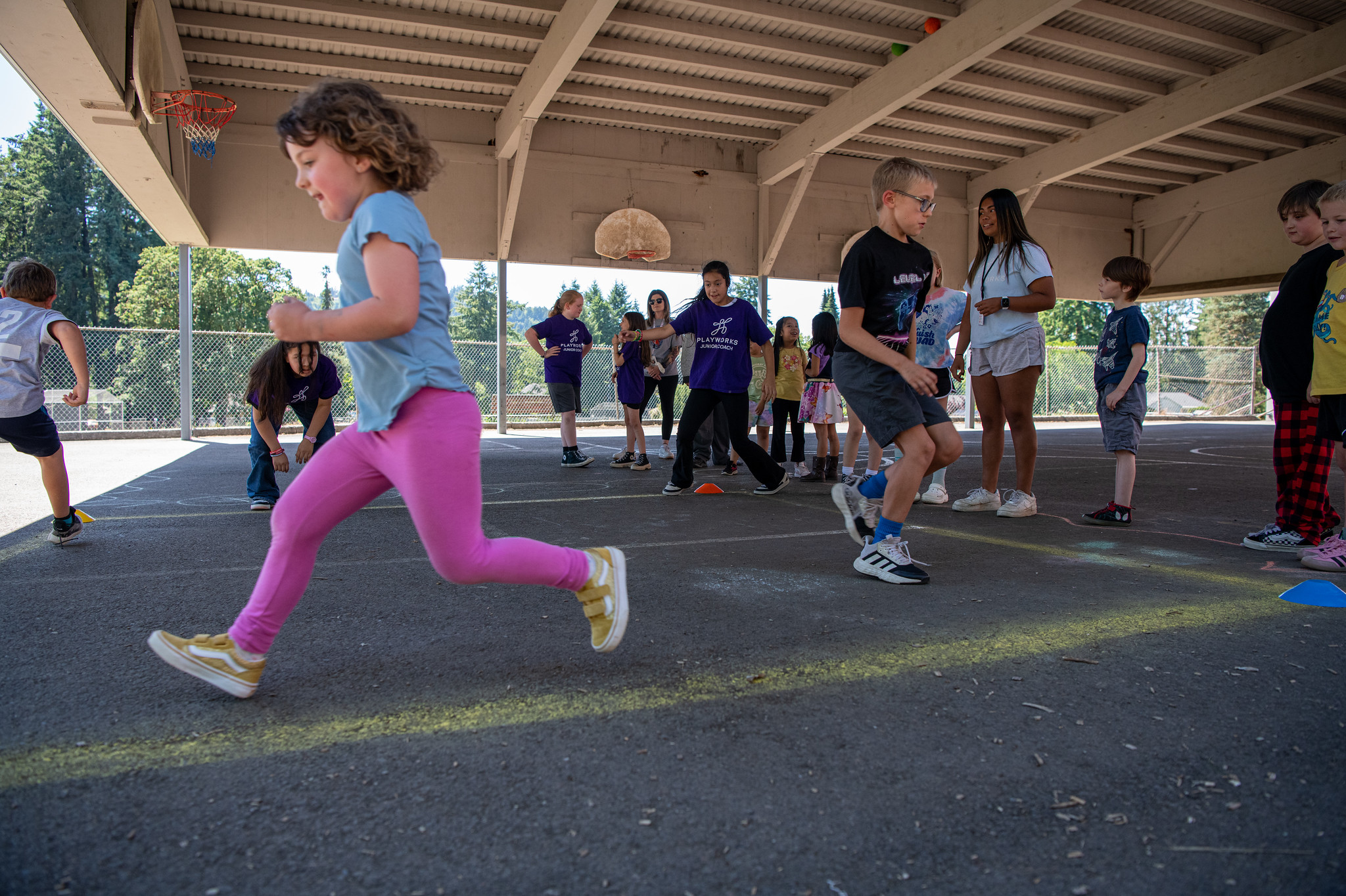 kids running across blacktop