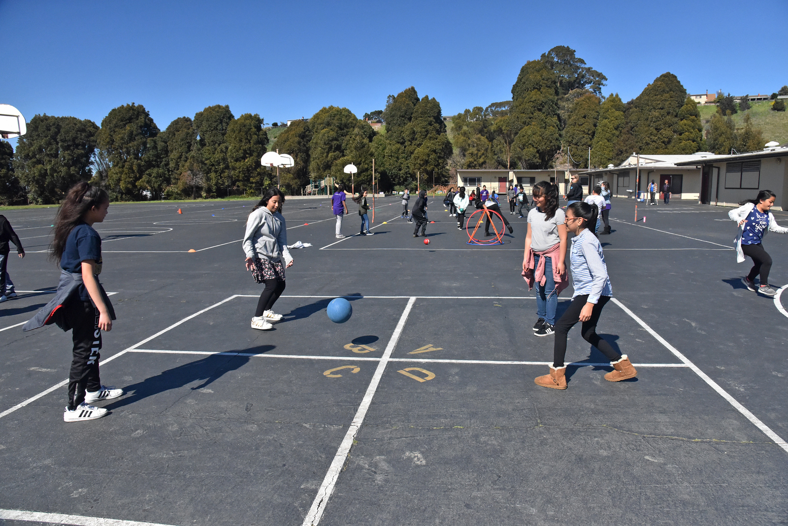 kids playing foursquare